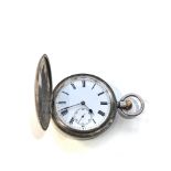 Antique Baume Longines silver full hunter pocket watch in working order but no warranty given case