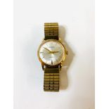 Garrard 9ct gold gents watch, winds and ticks but no warranty is given