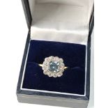 18ct Diamond and Aquamarine ring central aquamarine measures approx 6mm by 6mm with diamonds