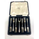 Boxed set of hallmarked silver forks and a pickle fork, total approximate weight 110g