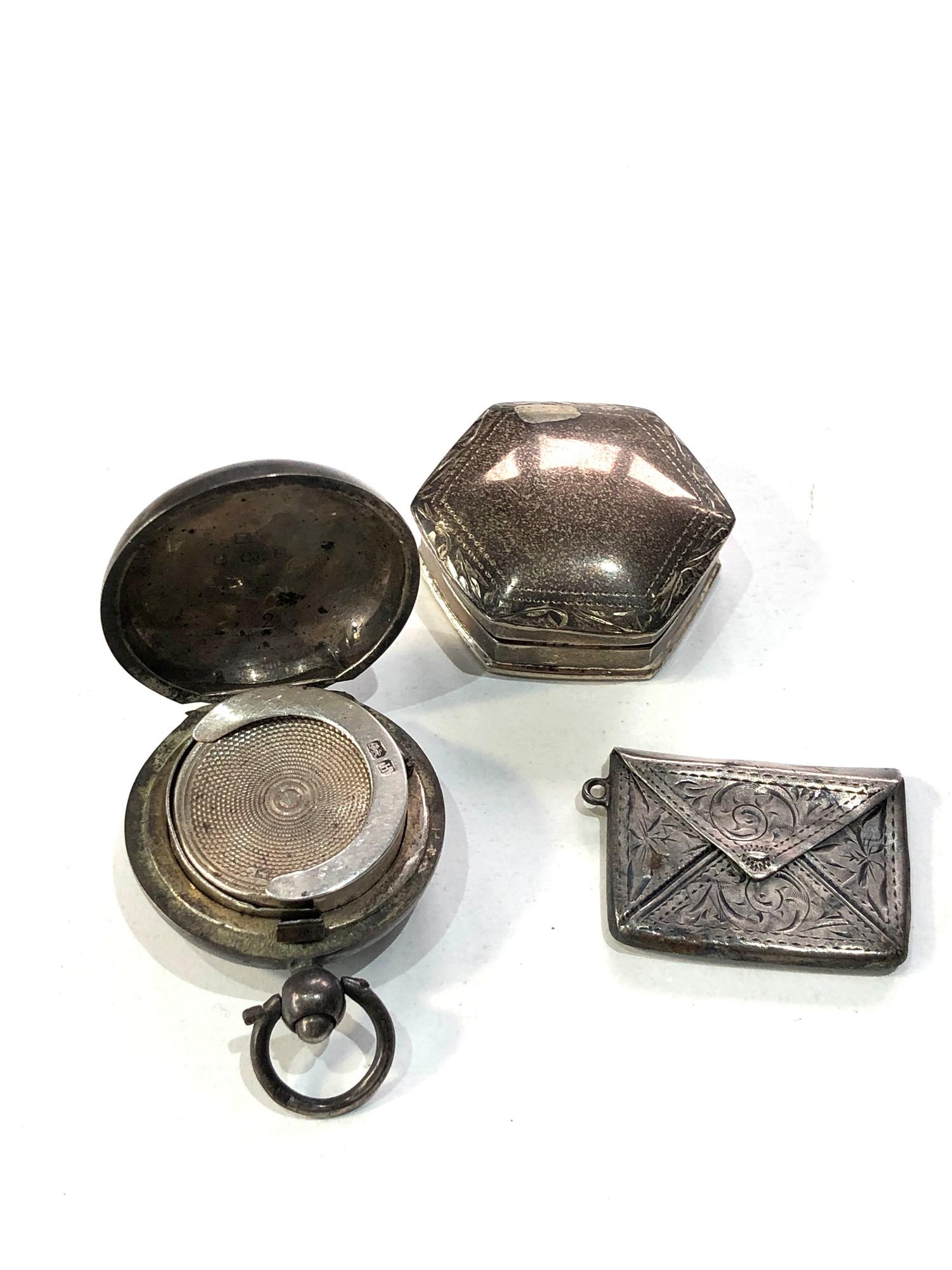 Selection of silver items includes pill box envelope stamp case and silver coin holder age related