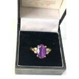 18ct gold diamond and Amethyst ring central amethyst measures approx 12mm by 8mm with diamonds