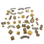 Collection of military shoulder collar sleeve badges including Dragon guards, Canadian Devon etc