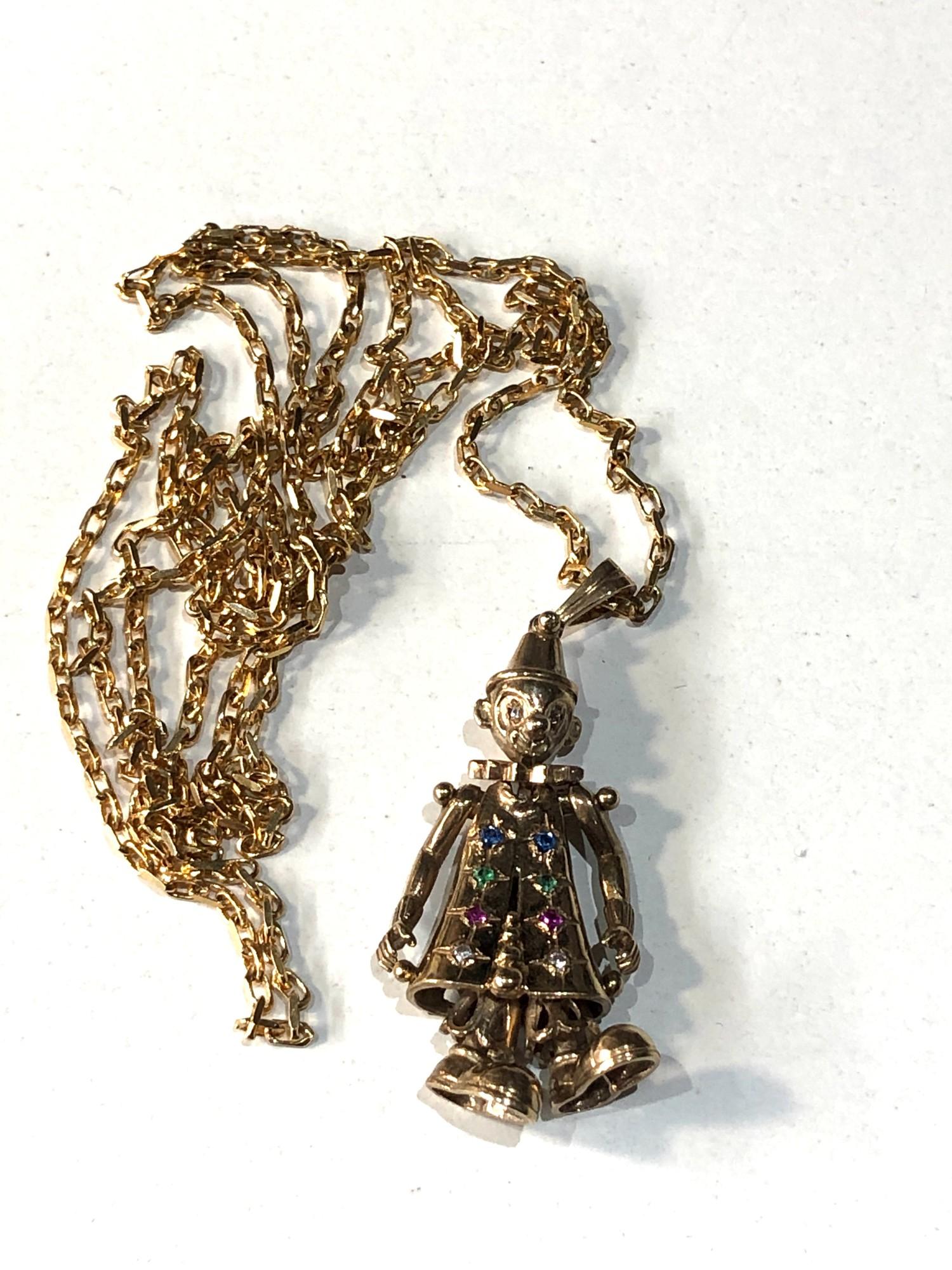 9ct gold articulated clown pendant and chain weight 13.5g