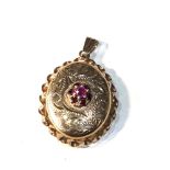 9ct gold garnet set locket pendant measures approx 3.3cm drop by 2cm wide weight 4.1g