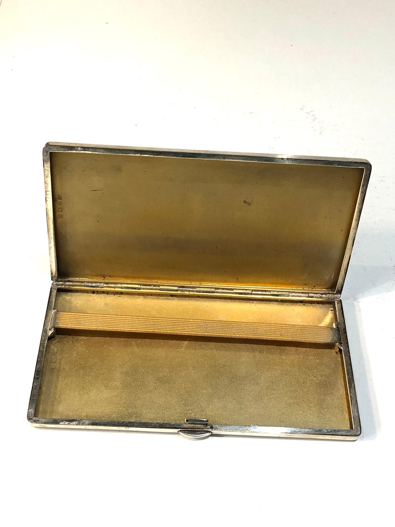 Large heavy engine turned cigarette case dog motif measures approx 15cm by 8cm weight 250g - Image 3 of 4