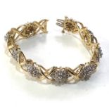 14ct gold diamond cluster bracelet measures approx 17cm long by 1.2cm wide weight approx 32g