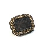 Gold victorian mourning brooch w/ hair measures approx 2.2cm by 1.7cm xrt tested as 9ct gold