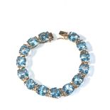9ct gold blue gem set bracelet each gem measures approx 9mm by 9mm braclet measures approx length