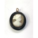 Antique jet hard stone cameo pendant measures approx 2.7cm by 2.2cm damage as shown