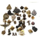 Collection of military and fire service badges