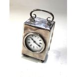 Antique silver carriage clock measures approx 6.5cm by 4.6cm by 4cm not including handle engraved
