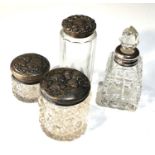 Selection of silver top bottles includes perfume bottle 2 cherub top jars in antique condition