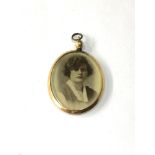 Antique gold framed picture locket measures approx 4.3cm drop by 2.8cm wide