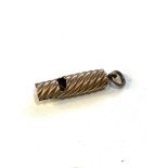 9ct gold working whistle w/ twisted design measures approx 4.3cm drop xrt tested as 9ct gold