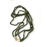 14ct gold clasp jade bead necklace with gold bead spacers 3 rows of jade beads