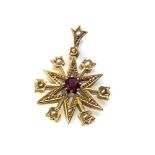 9ct gold garnet & seed pearl starburst pendant weight 2.6g measures approx 3.1cm drop by 2.2cm