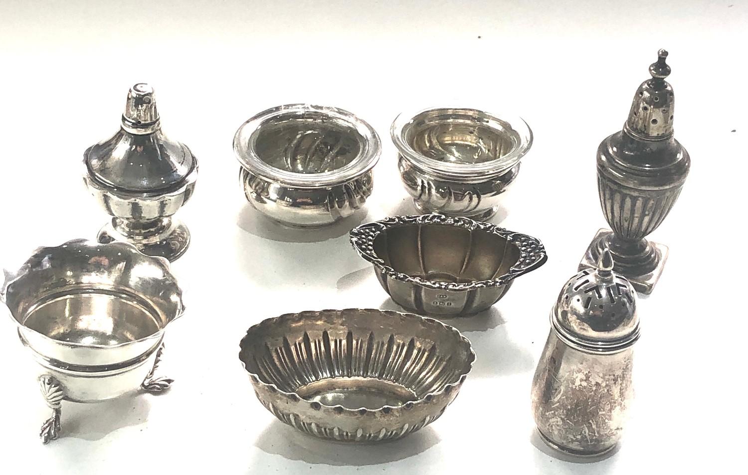 Selection of silver salt pepper pots some continental silver age related wear please see images