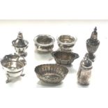 Selection of silver salt pepper pots some continental silver age related wear please see images