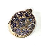 Antique gold back and front enamel locket measures approx 3.5cm drop by 2.6cm age related wear to