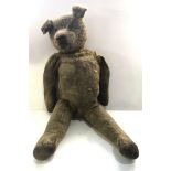 Antique Large Straw filled Teddy Bear with hump age related marks wear and repairs measures approx