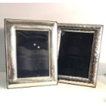 2 silver picture frames measure approx 24cm by 19cm
