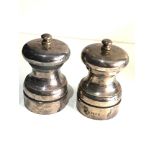 Pair of silver pepper mills measure approx 10.5cm tall London silver hallmarks