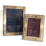 2 silver picture frames largest measures approx 22cm by 17cm