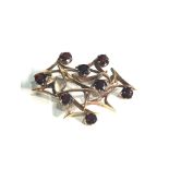 9ct gold geometric modernist garnet set brooch measures approx 4.2cm by 3cm weight 7.8g