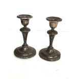 Pair of antique silver candlesticks filled bases measure approx 12.7cm tall birmingham silver