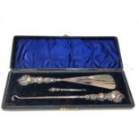 Boxed set of silver button hooks and shoe horn in fitted box largest measures approx 23cm long