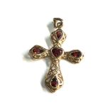 9ct gold garnet heart cut cross pendant measures approx 3.6cm drop by 2.4cm wide weight 2.1g