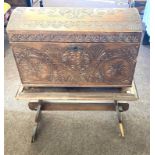 Antique carved casket on stand, damage to leg on base