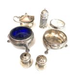 Selection of silver cruet items includes slts mustard pepper etc