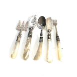 Selection of antique silver and mop handled pickle forks butter knifes etc