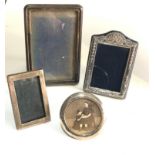 4 small antique / vintage silver picture frames largest measures approx 15.5cm by 10.5