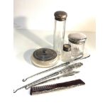 Selection of silver items includes silver top dressing table bottles button hooks etc