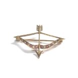 9ct gold bow & arrow brooch set with ruby and white sapphires measures approx 4.2cm by 3cm weight