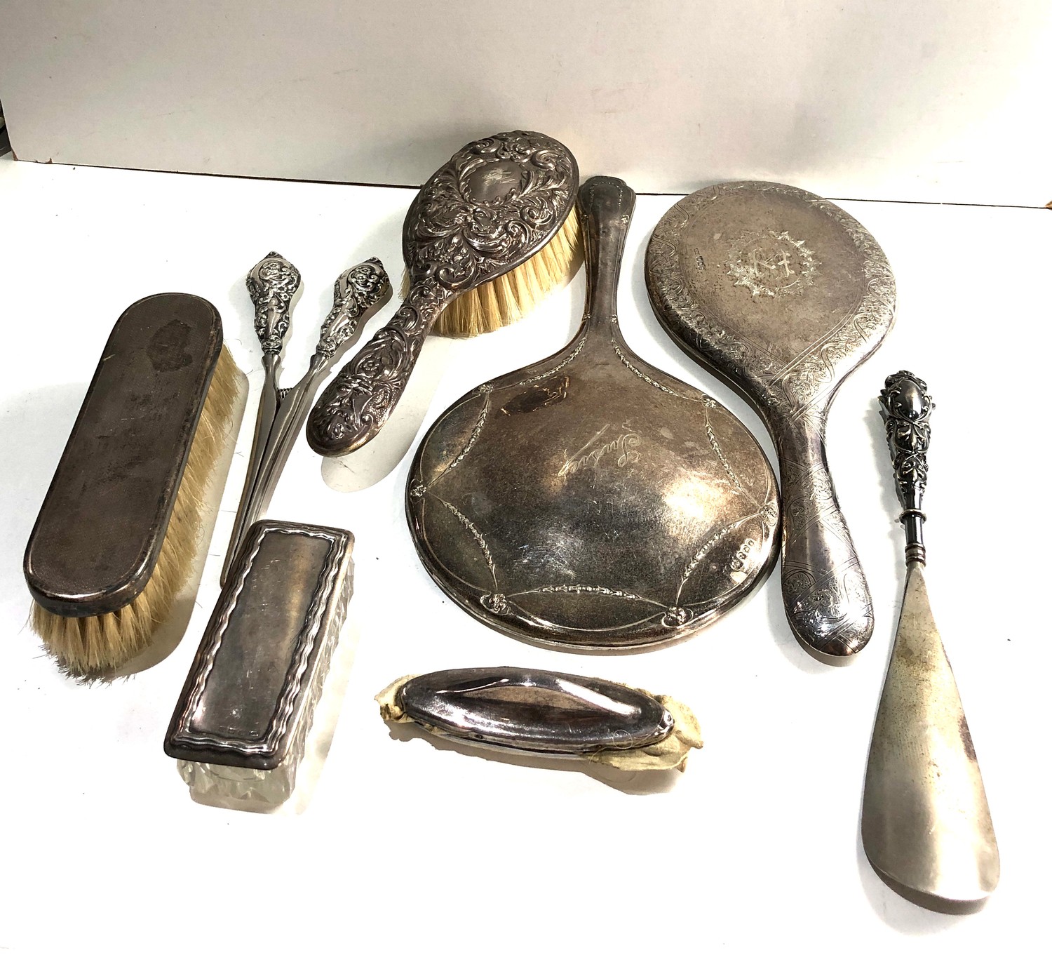 Selection of silver items includes dressing table mirrors brushes etc