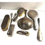 Selection of silver items includes dressing table mirrors brushes etc