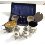 Selection of silver items salt peppers etc