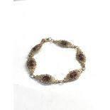 9ct Gold ornate garnet detail bracelet weight 8g