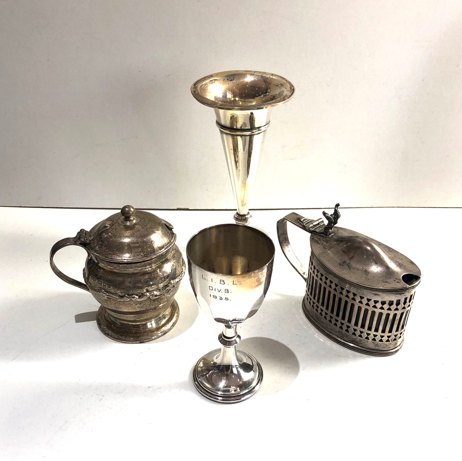 Selection of silver items includes mustard pots posy vase and egg cup weighable silver weight 260g