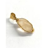 18ct gold rock crystal pendant measures approx 3.4cm drop by 1.1cm wide weight 4.3g xrt tested as