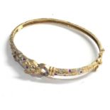 9ct gold leopards head ruby and diamond hinged bangle measures approx 6.5cm by 5.3cm weight 10.6g