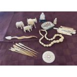 Selection antique ivory pieces to include a purse, necklace, animals etc