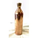 Copper bottle with brass screw top, approximate height 11 inches