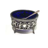 Antique silver salt pot with cherub detail blue glass liner measures approx 7.5cm by 5.5cm height