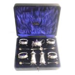 Large boxed 7 piece cruet set with spoon with blue glass liners Birmingham silver maker W.A