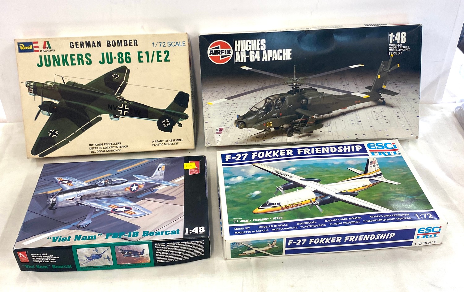 Selection of 4 Model boxed air crafts includes, German bomber, Hughes Ah-64, Viet Nam, F-27 Fokker